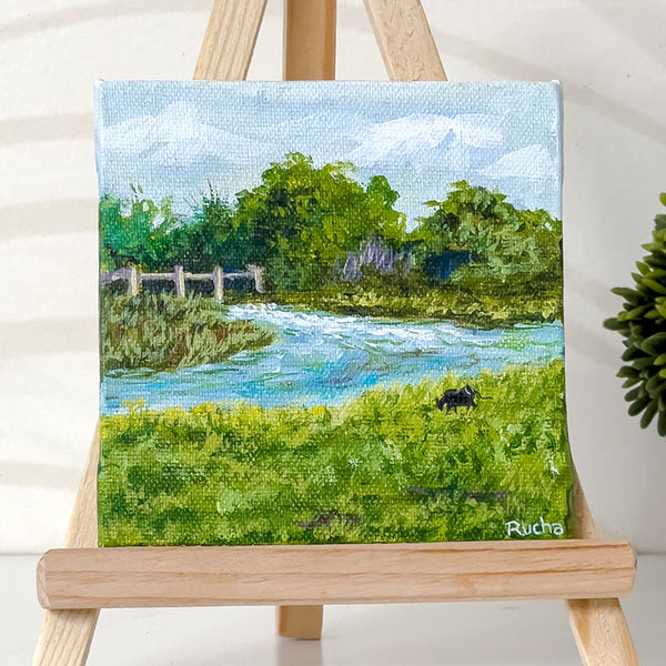 Cattle grazing on a riverside - Painting